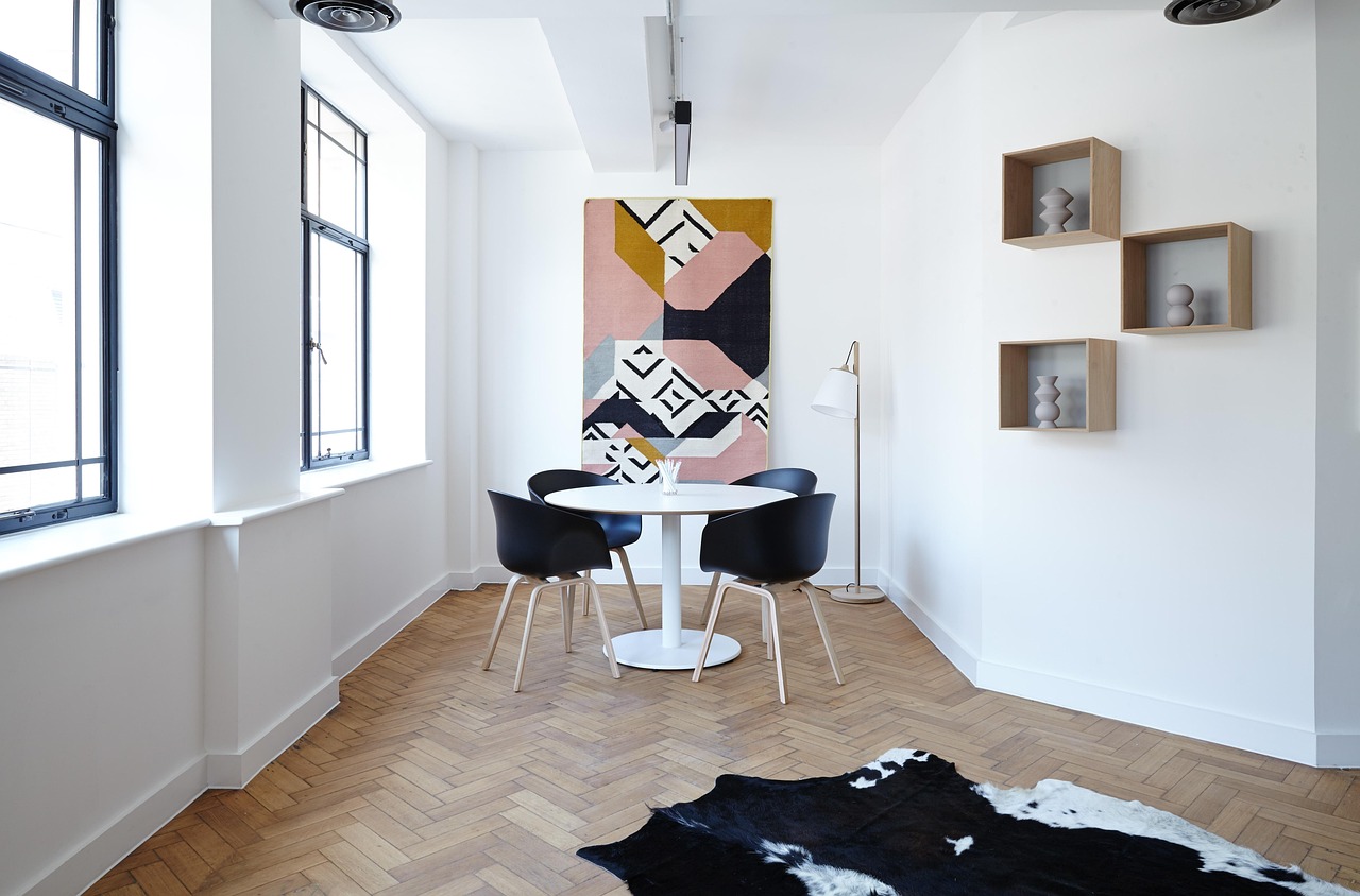 Modern dining room with white walls and a round table